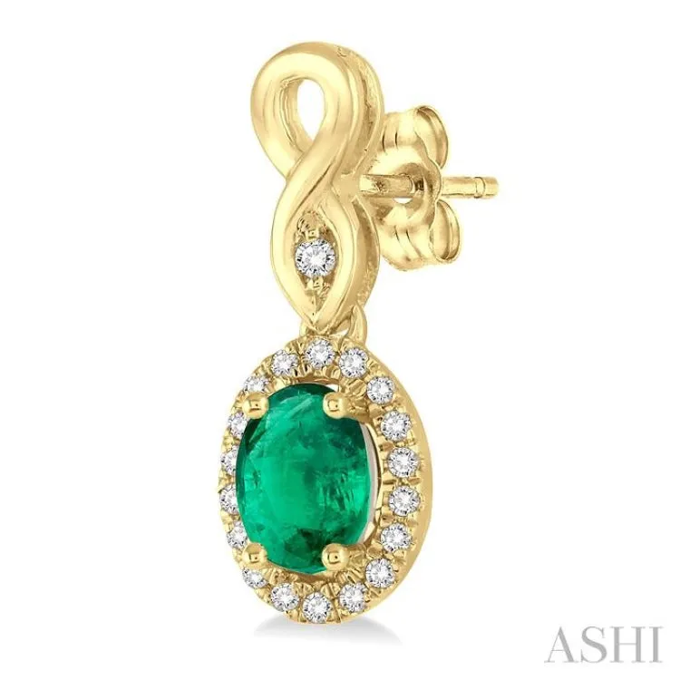 5x3 MM Oval Cut Emerald and 1/6 ctw Round Cut Diamond Earrings in 10K Yellow Gold