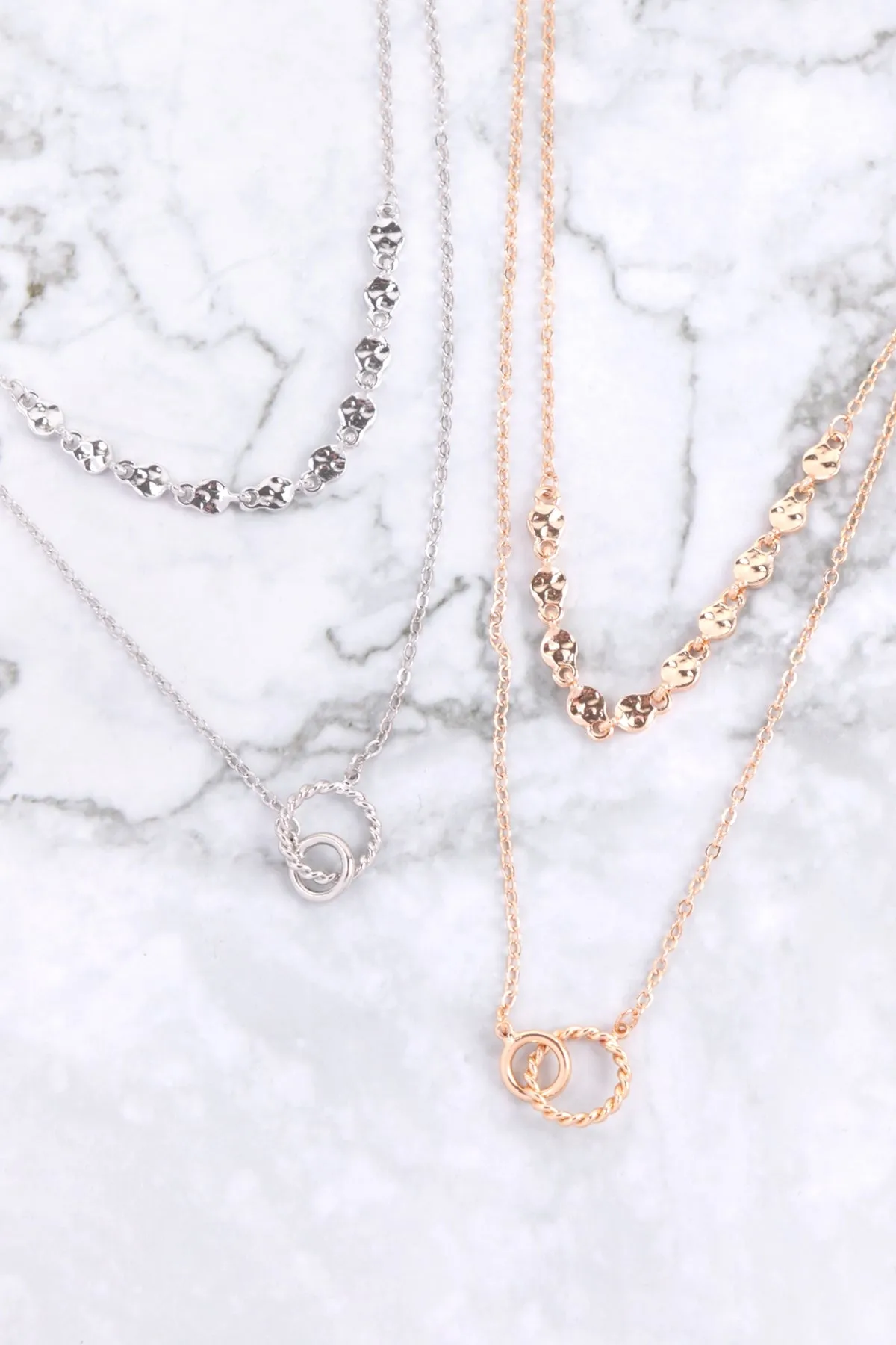 DOUBLE RING TWISTED PENDANT MULTI CHAIN LAYERED BRASS NECKLACE AND EARRING SET