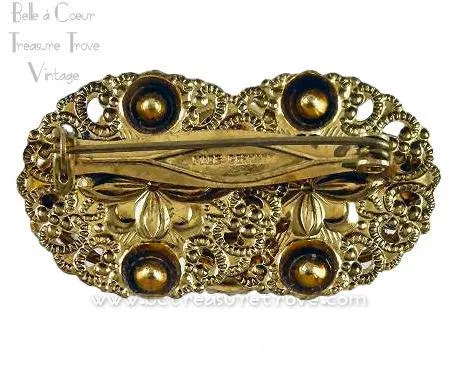 German Repousse Goldtone Brooch Variegated Blue Art Glass