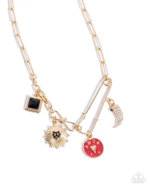 Trendy Trinket - Gold - Heart and Sun Charm Safety Pin Paparazzi Short Necklace - 2024 Dare to Dream Convention Exclusive