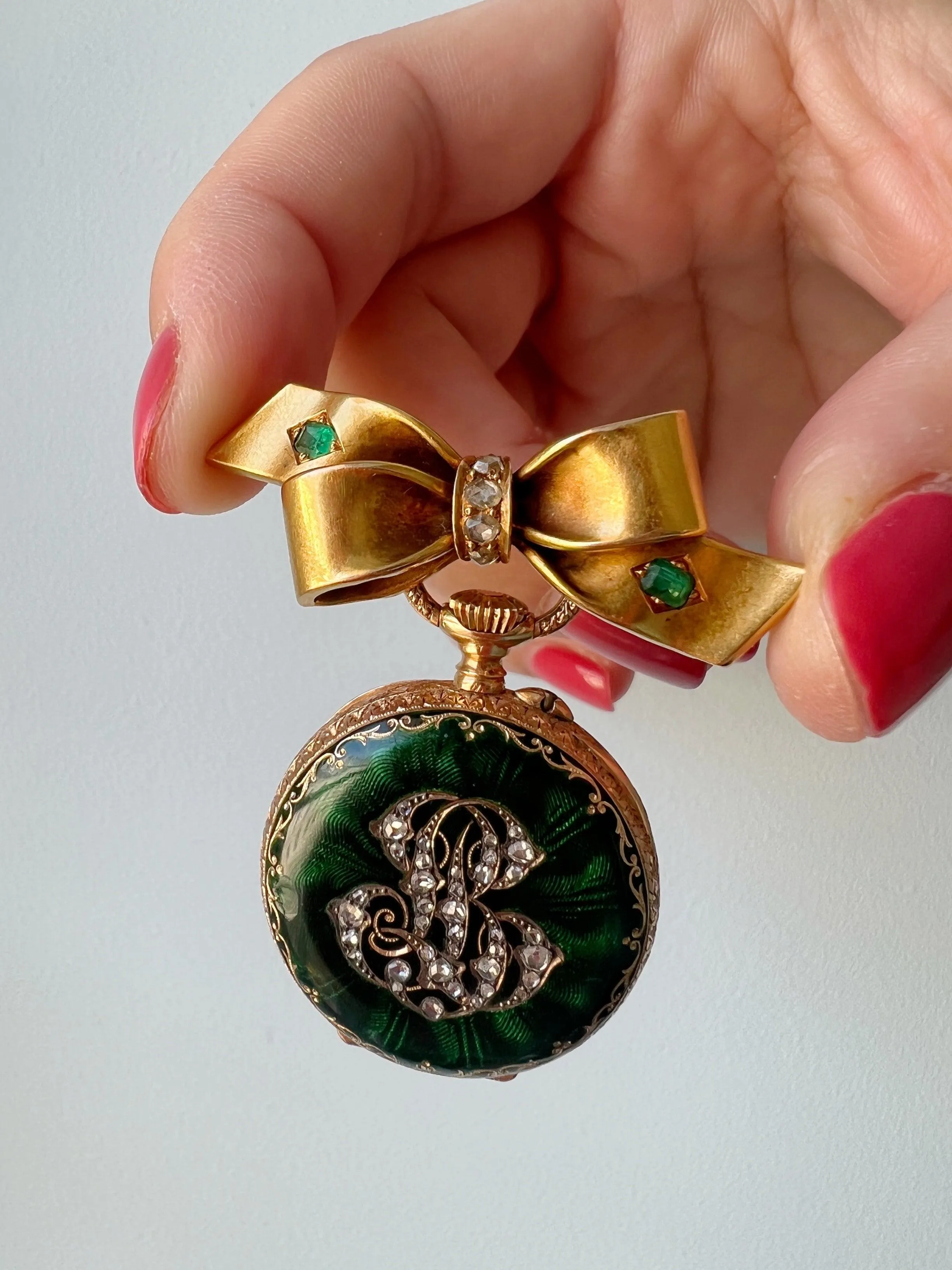 Very sweet antique 18K gold emerald diamond bow brooch